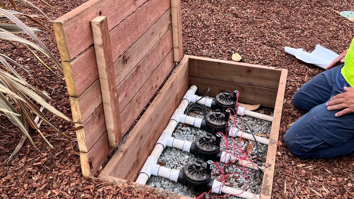 Certified irrigation technician servicing a landscape irrigation system in San Jose